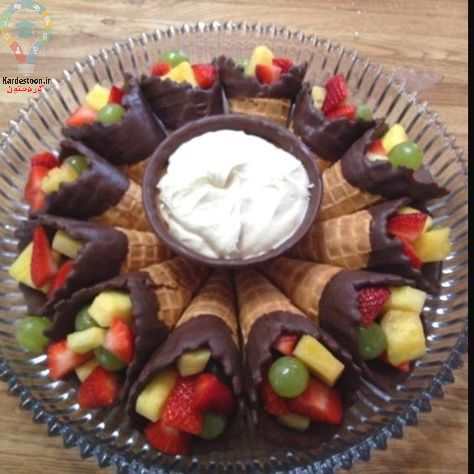 تزیین میز شب یلدایی با میوه و شیرینی و اجیل